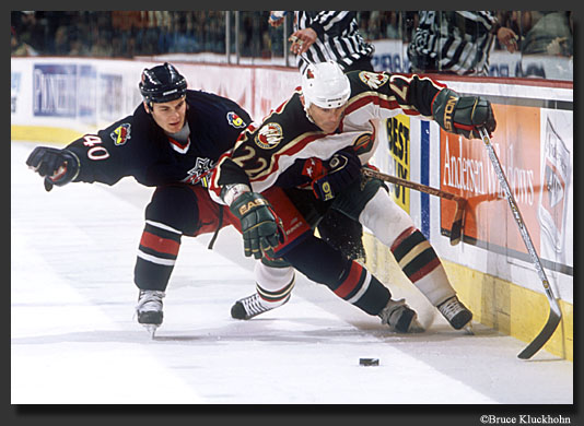 photo of Stacy Roest bringing the puck down the ice